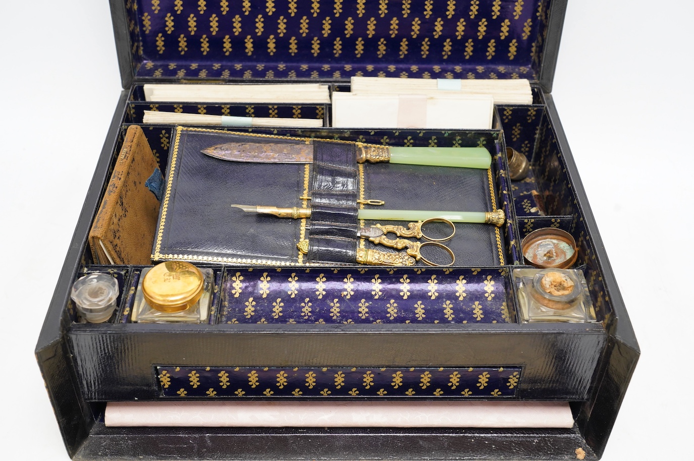 A Victorian black Moroccan leather paper lined and fitted writing box, with some implements, 30cm x 12.5cm. Condition - fair